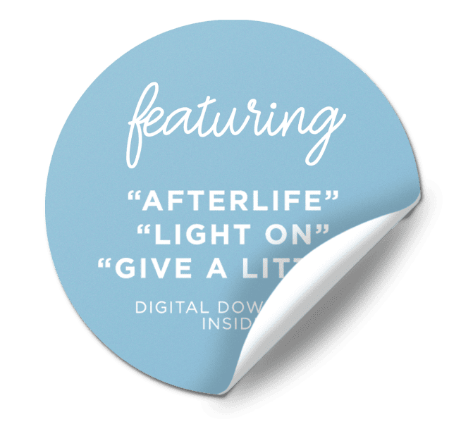 A blue circular sticker with a curled edge that reads 'featuring AFTERLIFE, LIGHT ON, GIVE A LITTLE’ and ‘DIGITAL DOWNLOAD INSIDE' in white text.
